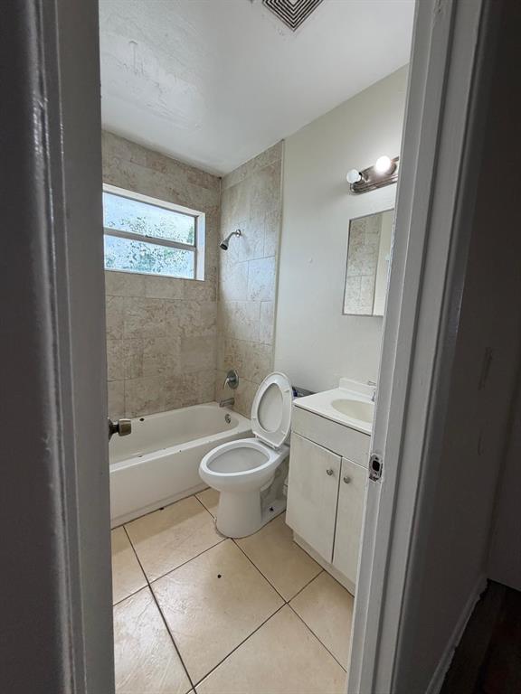 143 West 17th Street Riviera Beach, FL 33404 - Photo 11 of 13 a bathroom with a sink a toilet and shower