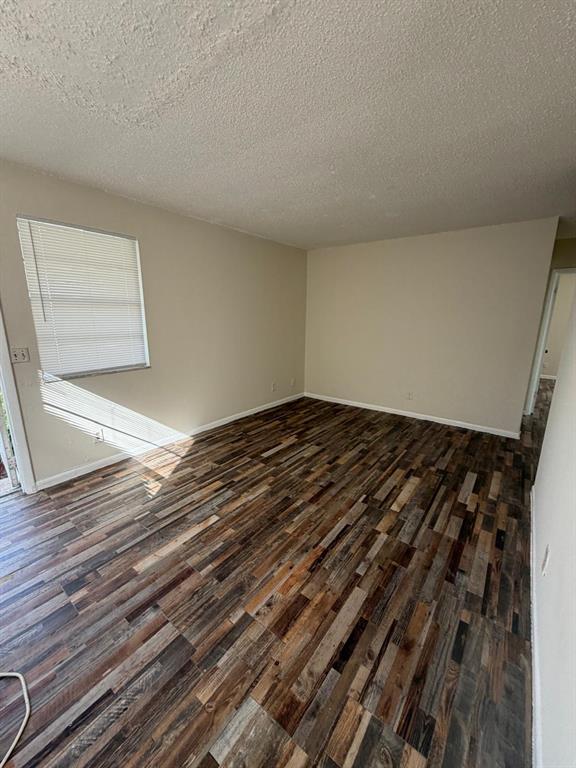143 West 17th Street Riviera Beach, FL 33404 - Photo 7 of 13 a view of a room with wooden floor