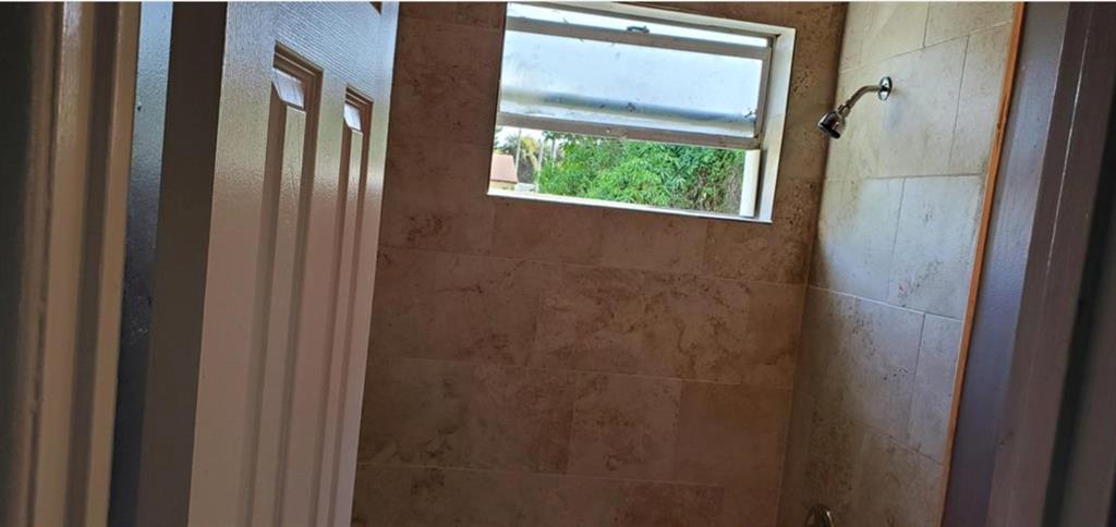 143 West 17th Street Riviera Beach, FL 33404 - Photo 10 of 13 a bathroom with a window