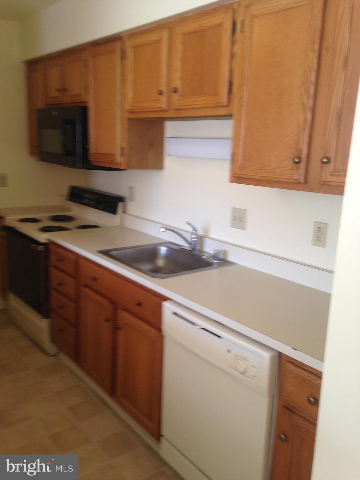 101 Morgnec Road Chestertown, MD 21620 - Photo 7 of 11 a kitchen with a sink and cabinets