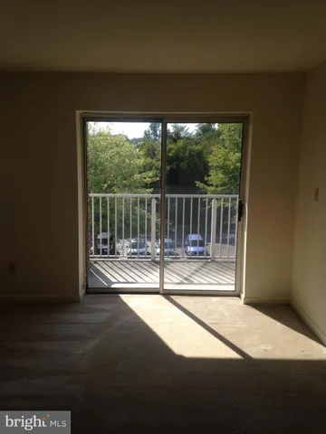 a view of a balcony with floor to ceiling window
