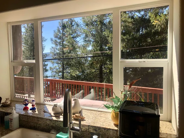 a view of a living room and a floor to ceiling window