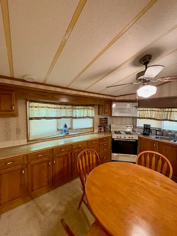 a bed room with a bed window and a chandelier