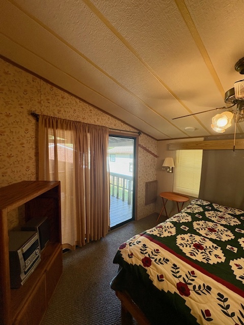 21-244 Woodhaven Sublette, IL 61367 - Photo 25 of 28 a bedroom with a bed and a tv