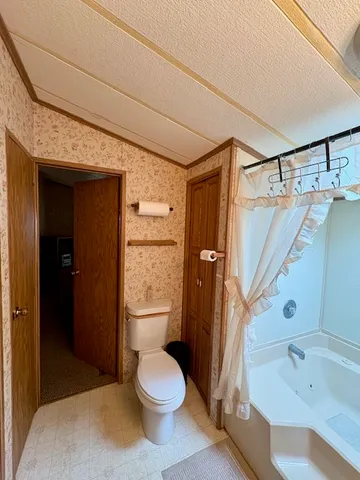a bathroom with a sink a mirror and a shower