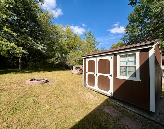 21-244 Woodhaven Sublette, IL 61367 - Photo 9 of 28 a backyard of a house with yard and wooden fence