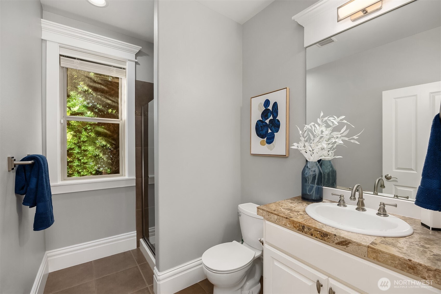 2989 Northeast Davis Loop Issaquah, WA 98029 - Photo 20 of 40 a bathroom with a granite countertop sink toilet and mirror