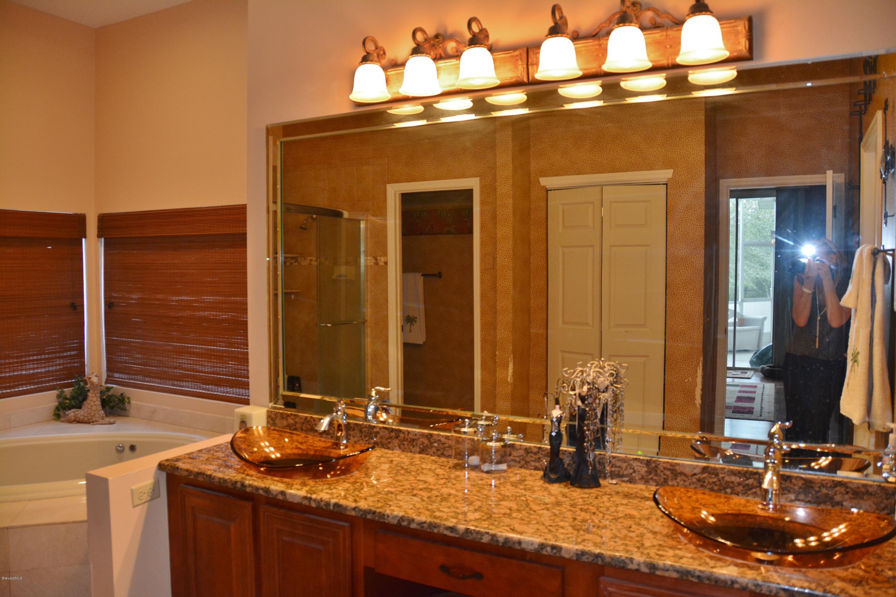 4533 Canard Road Melbourne, FL 32934 - Photo 14 of 38 Master - Granite & Vessel sinks