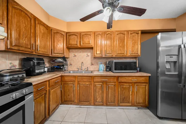 a dining room with furniture and chandelier