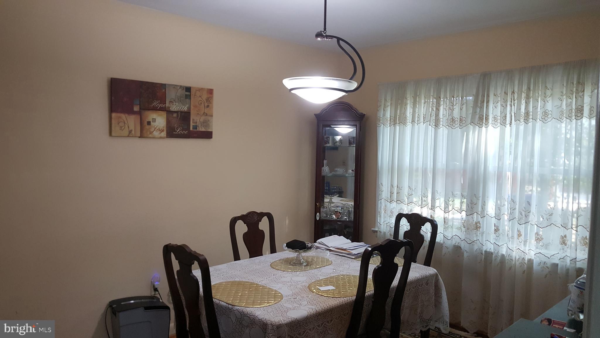6216 Stoneham Road Bethesda, MD 20817 - Photo 13 of 41 Separate Dining area with double window