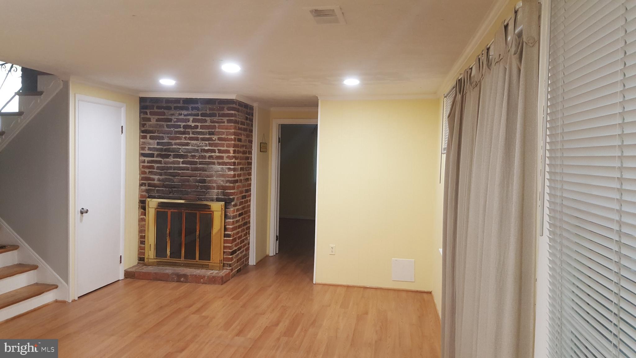 6216 Stoneham Road Bethesda, MD 20817 - Photo 22 of 41 Family room with Fireplace and recessed lights