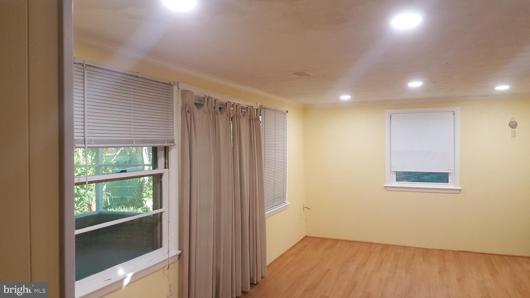 6216 Stoneham Road Bethesda, MD 20817 - Photo 23 of 41 Family room leads to covered rear porch