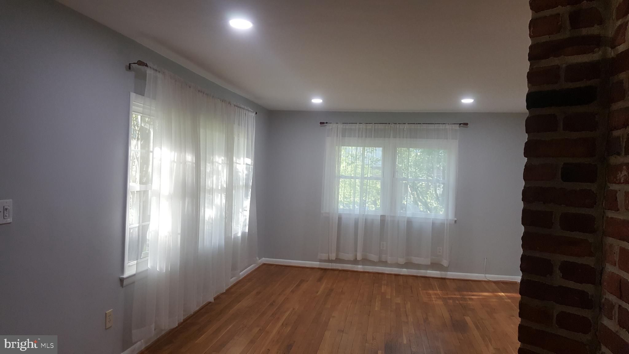 Living room with recessed lights  and large window