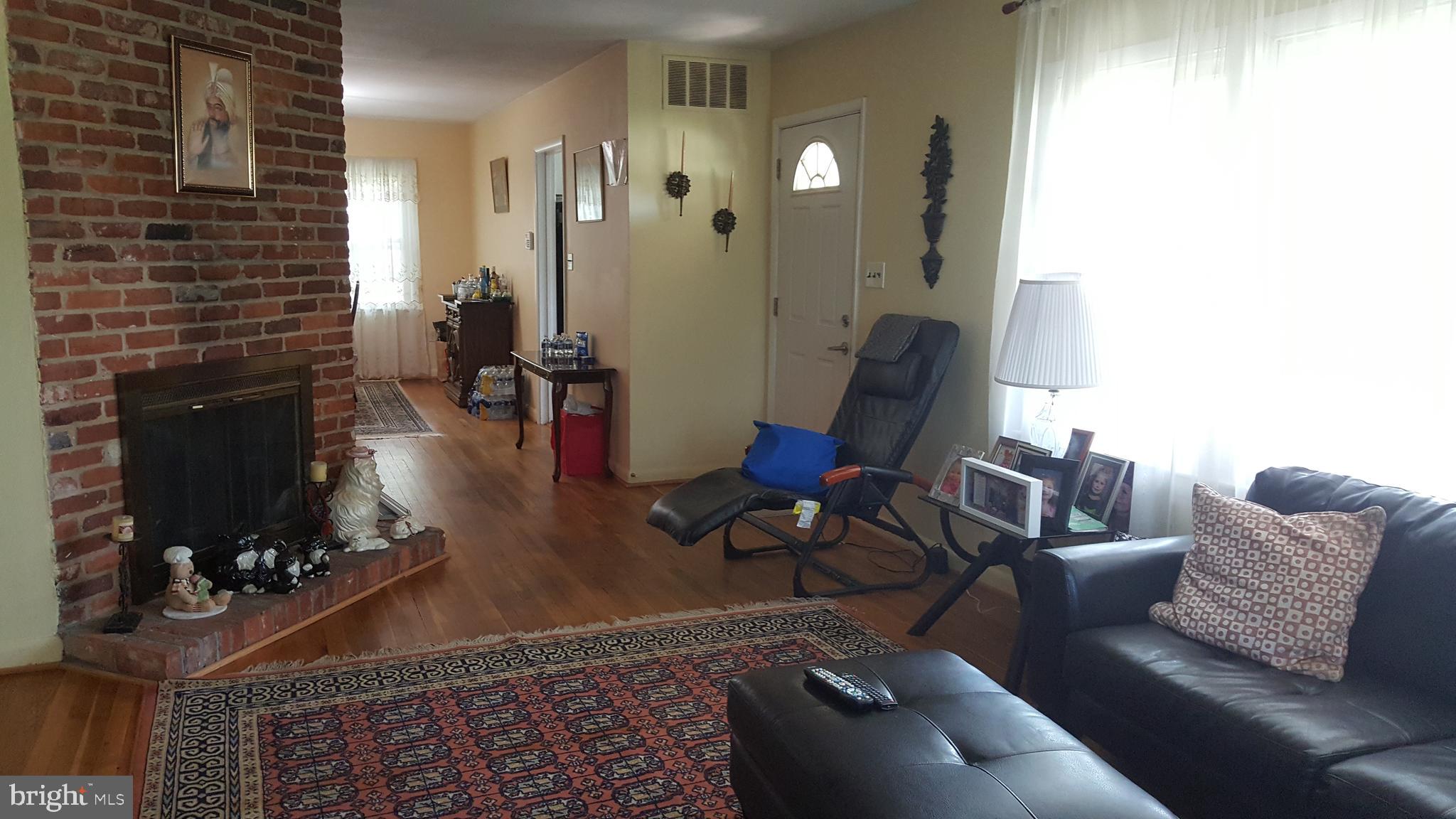 Hardwood floor on the main level. LR leading to DR