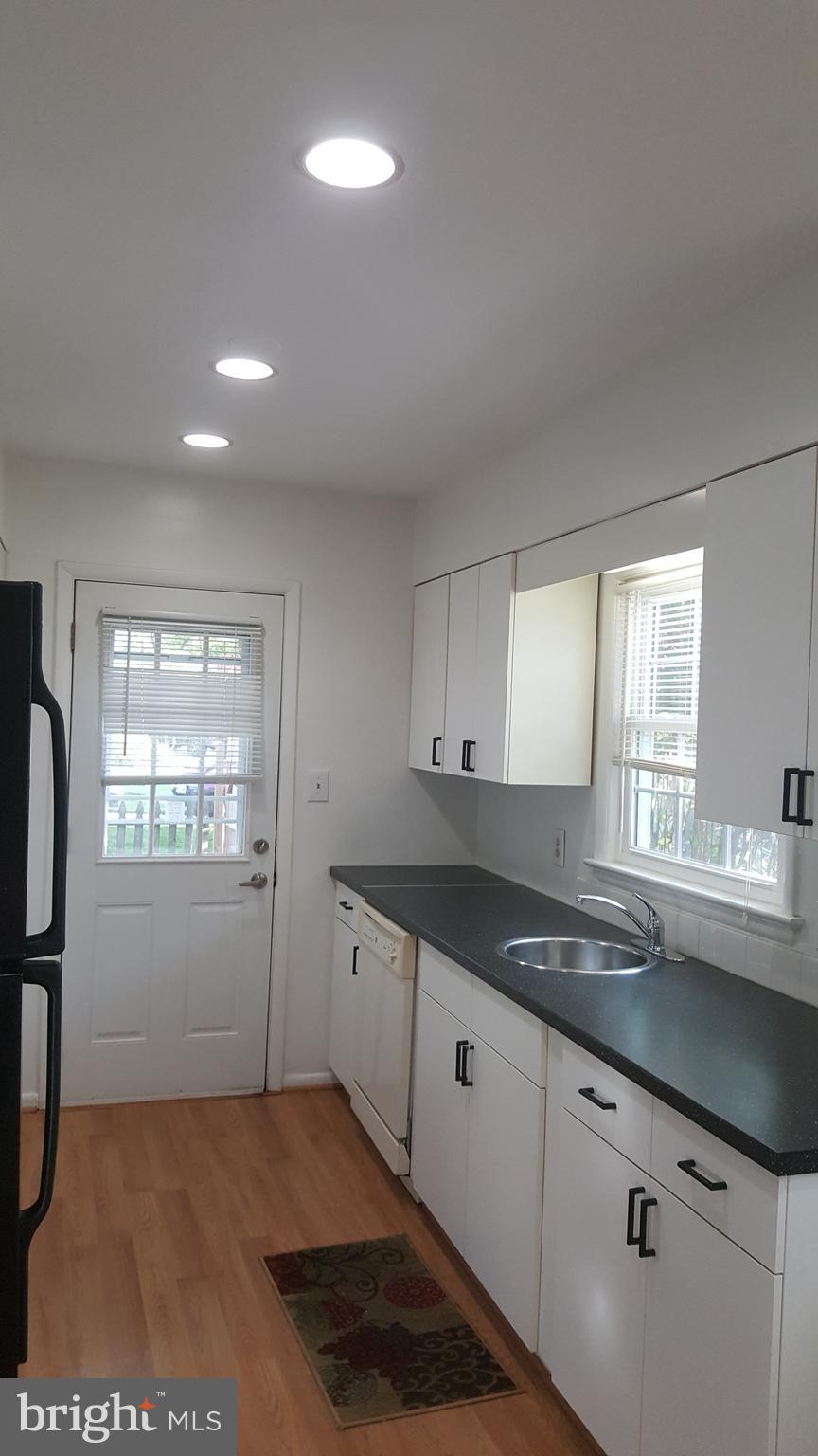 6216 Stoneham Road Bethesda, MD 20817 - Photo 10 of 41 Side entrance door to the kitchen