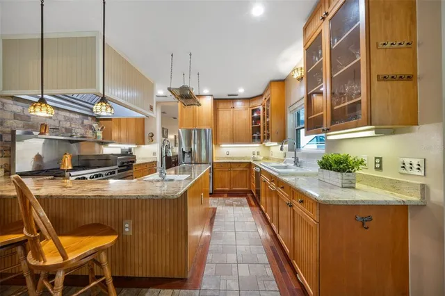 a living room with furniture a rug and a chandelier