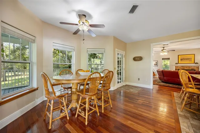 a view of a hallway view with wooden floor and staircase