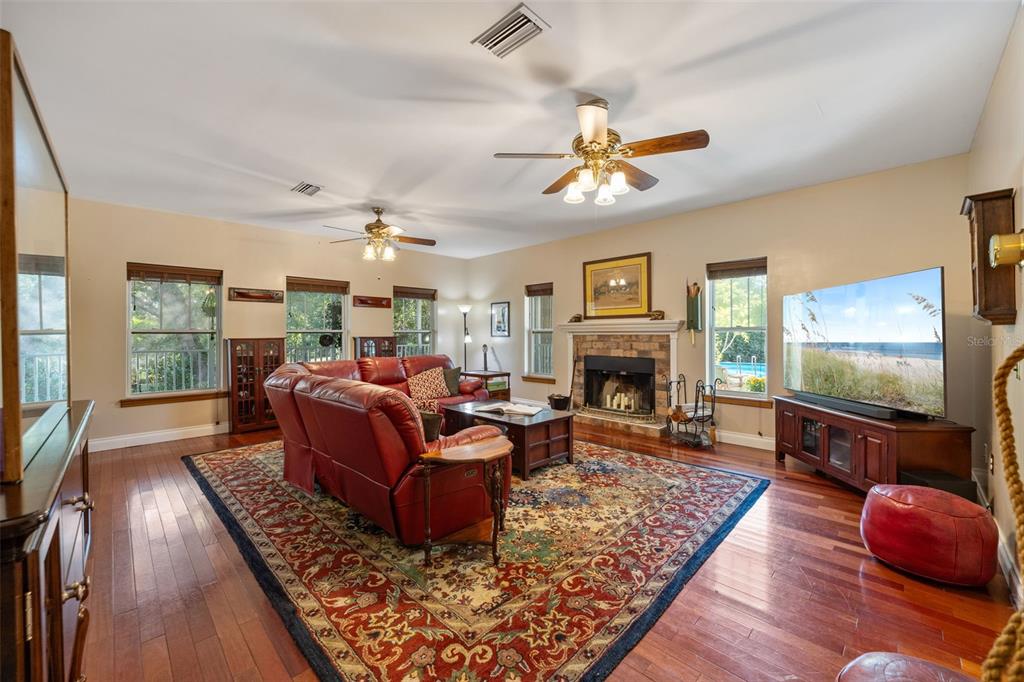 37810 Boyd Road Myakka City, FL 34251 - Photo 27 of 98 a living room with furniture fireplace and flat screen tv