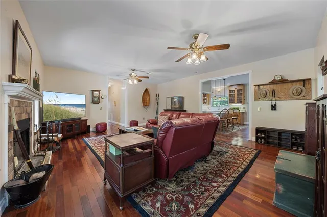 a spacious bedroom with a bed and wooden floor