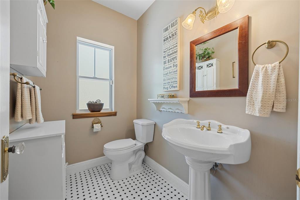 37810 Boyd Road Myakka City, FL 34251 - Photo 31 of 98 a bathroom with a sink a toilet and mirror