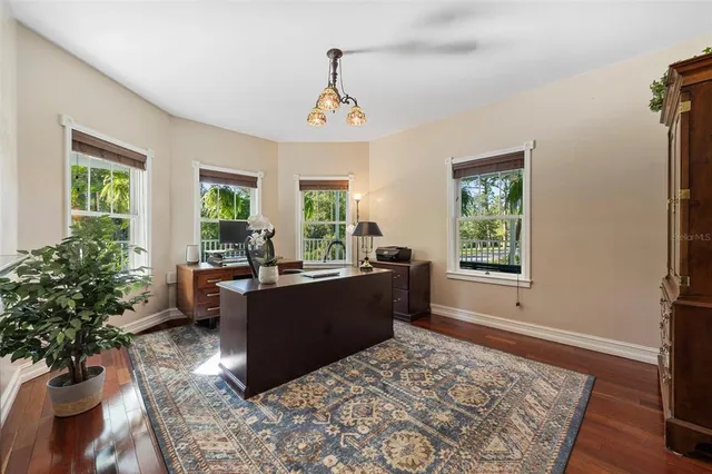 a living room with furniture and a book shelf