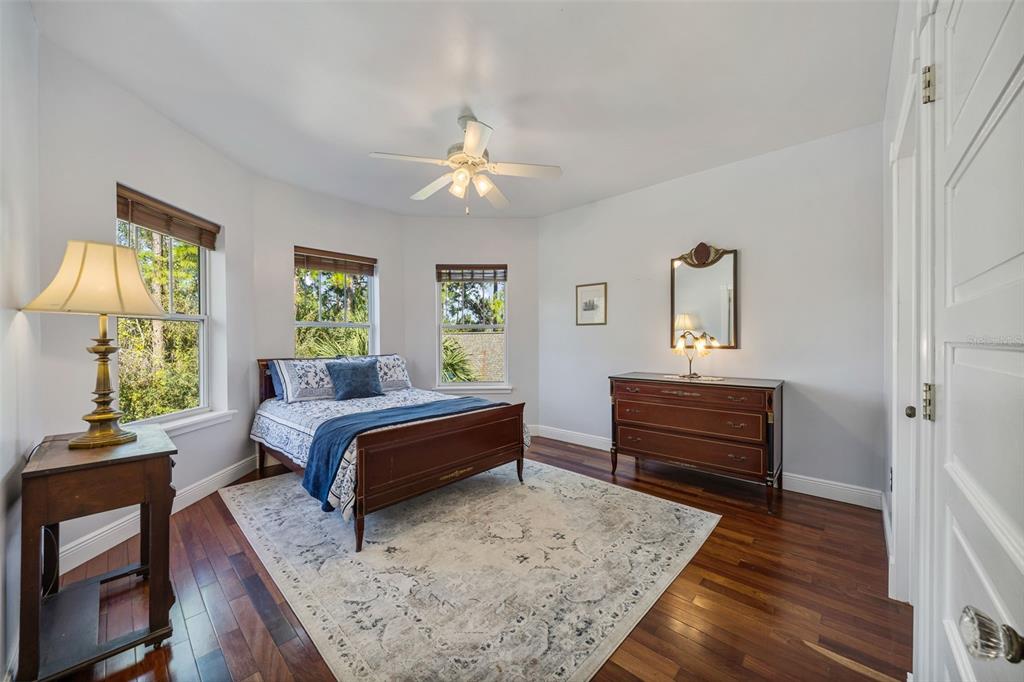 37810 Boyd Road Myakka City, FL 34251 - Photo 44 of 98 a bedroom with furniture and a large window