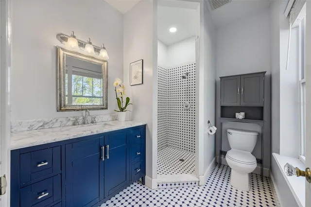 an aerial view of beach and residential houses with outdoor space