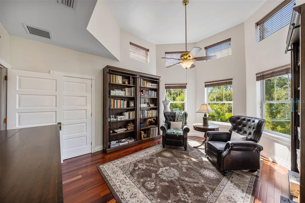 37810 Boyd Road Myakka City, FL 34251 - Photo 48 of 98 a living room with furniture and a book shelf