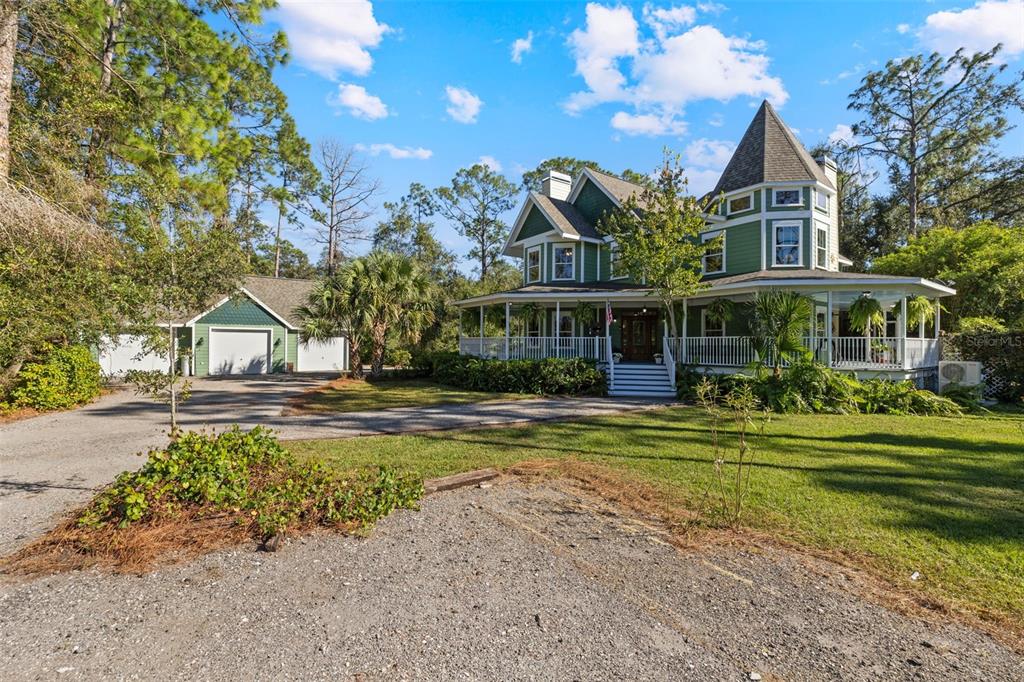 37810 Boyd Road Myakka City, FL 34251 - Photo 9 of 98 a front view of a house with swimming pool having outdoor seating