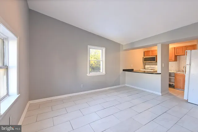 a view of an empty room with a window