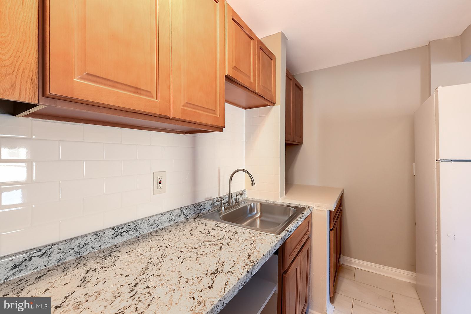 1436 West Baltimore Street, Unit 2 Baltimore, MD 21223 - Photo 6 of 11 a kitchen with a sink and a window