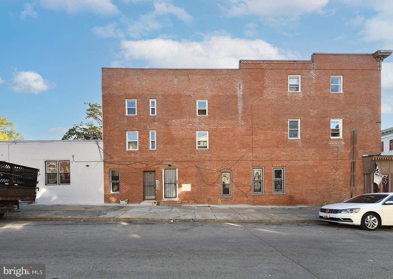 1436 West Baltimore Street, Unit 2 Baltimore, MD 21223 - Photo 9 of 11 a car parked in front of a building