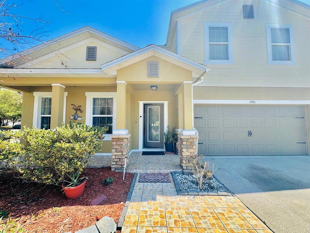1901 Nations Way St. Cloud, FL 34769 - Photo 1 of 17 a front view of house with yard