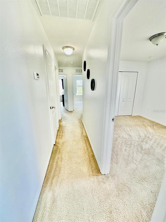 1901 Nations Way St. Cloud, FL 34769 - Photo 11 of 17 a view of a hallway with a bathroom