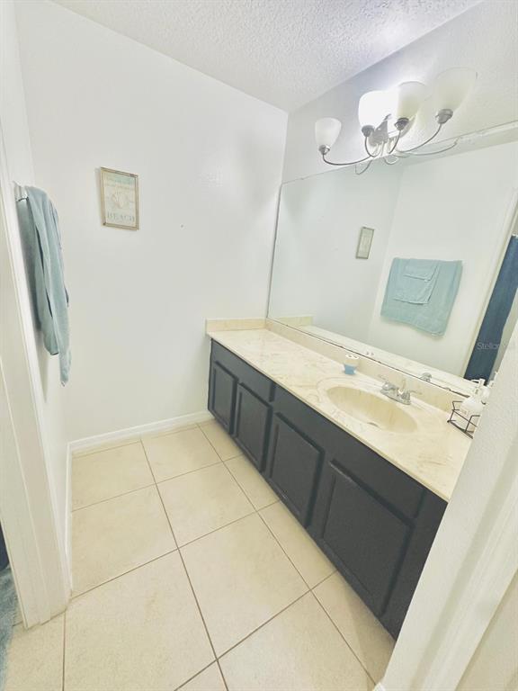1901 Nations Way St. Cloud, FL 34769 - Photo 12 of 17 a bathroom with a sink vanity and mirror