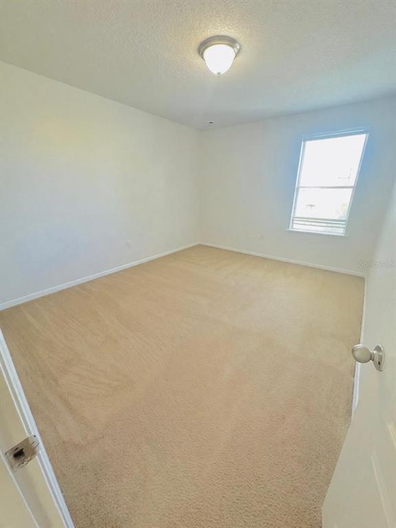 1901 Nations Way St. Cloud, FL 34769 - Photo 16 of 17 an empty room with a window