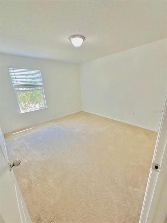 1901 Nations Way St. Cloud, FL 34769 - Photo 17 of 17 an empty room with a window