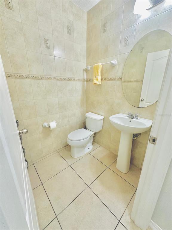 1901 Nations Way St. Cloud, FL 34769 - Photo 7 of 17 a bathroom with a sink and a mirror