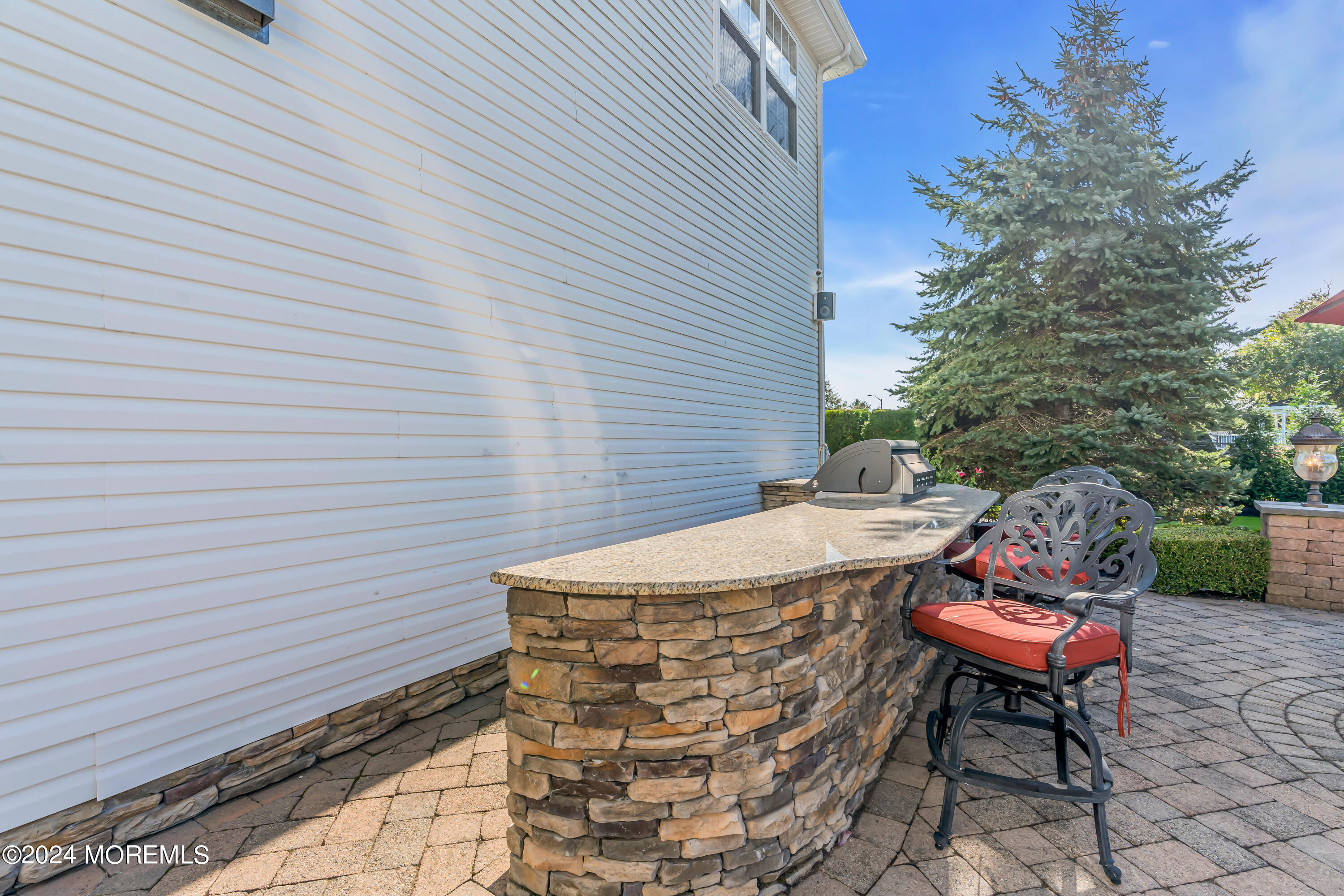 12 Rodeo Drive Jackson, NJ 08527 - Photo 72 of 114 a backyard of a house with table and chairs