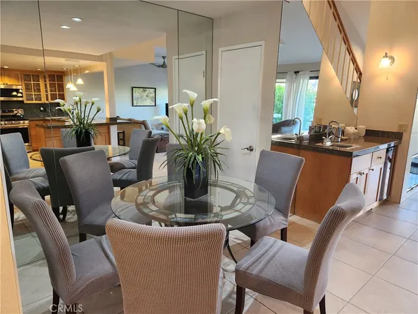 a dining room with furniture and wooden floor