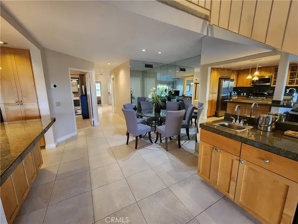 a lobby with furniture and floor to ceiling window