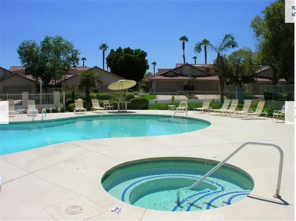 a view of a swimming pool with a patio