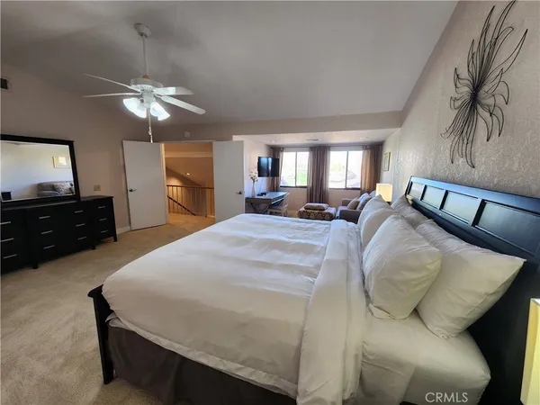 a bed room with a bed and a television