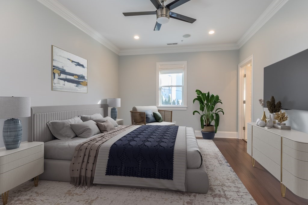 41 Wenham Street, Unit 3 Boston, MA 02130 - Photo 5 of 13 a bedroom with a balcony a bed and a couch