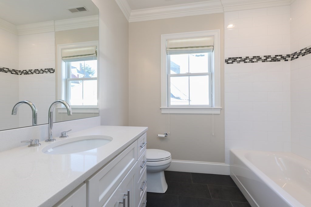 41 Wenham Street, Unit 3 Boston, MA 02130 - Photo 10 of 13 a bathroom with a sink toilet and shower