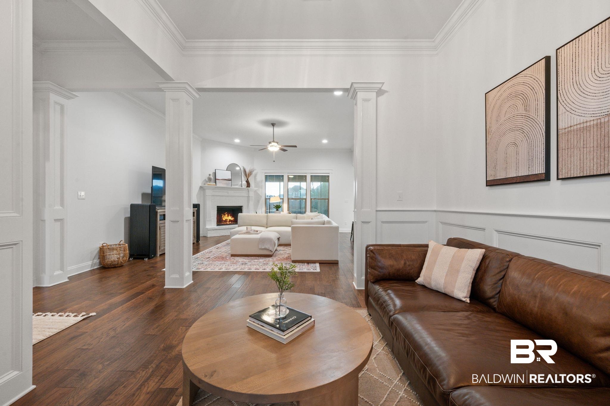 418 Fortune Drive Fairhope, AL 36532 - Photo 9 of 63 Living room with dark hardwood / wood-style floors, ornamental molding, decorative columns, and ceiling fan