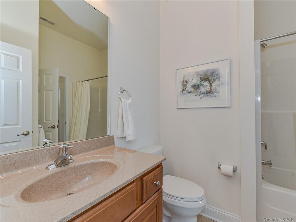 850 Platinum Drive Fort Mill, SC 29708 - Photo 12 of 47 a bathroom with a granite countertop sink a toilet and a mirror