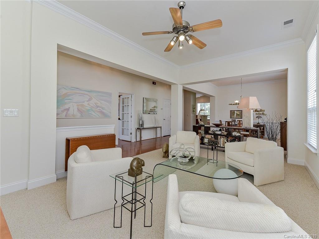 850 Platinum Drive Fort Mill, SC 29708 - Photo 15 of 47 a living room with furniture and a chandelier