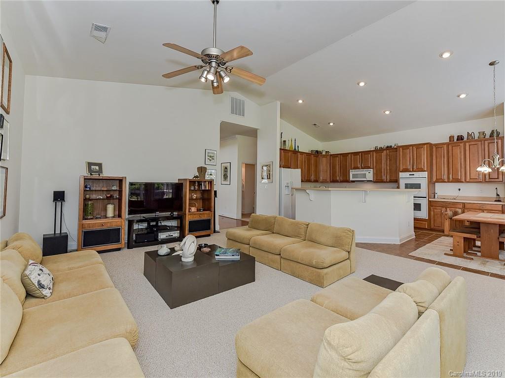 850 Platinum Drive Fort Mill, SC 29708 - Photo 22 of 47 a living room with furniture kitchen view and a chandelier
