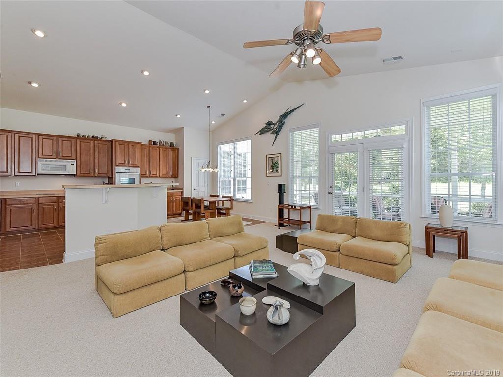 850 Platinum Drive Fort Mill, SC 29708 - Photo 23 of 47 a living room with furniture and a large window with kitchen view